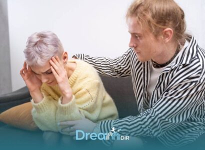 Autistic girl showing emotional distress while another person offers comfort, illustrating support during