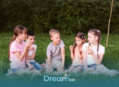 Group of autistic kids sitting on grass sharing snacks and interacting, representing social engagement and peer communication