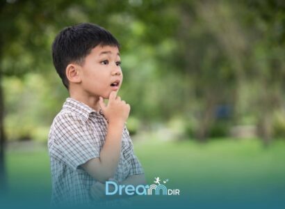 Thoughtful autistic boy outdoors touching chin while observing surroundings, representing curiosity and cognitive development