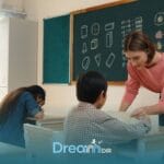Therapist  supporting autistic kids in a classroom activity while using DIR principles and interactive educational learning
