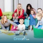 Autistic kids & therapsits participating in a social skills group activity for young kids with autism in a supportive setting
