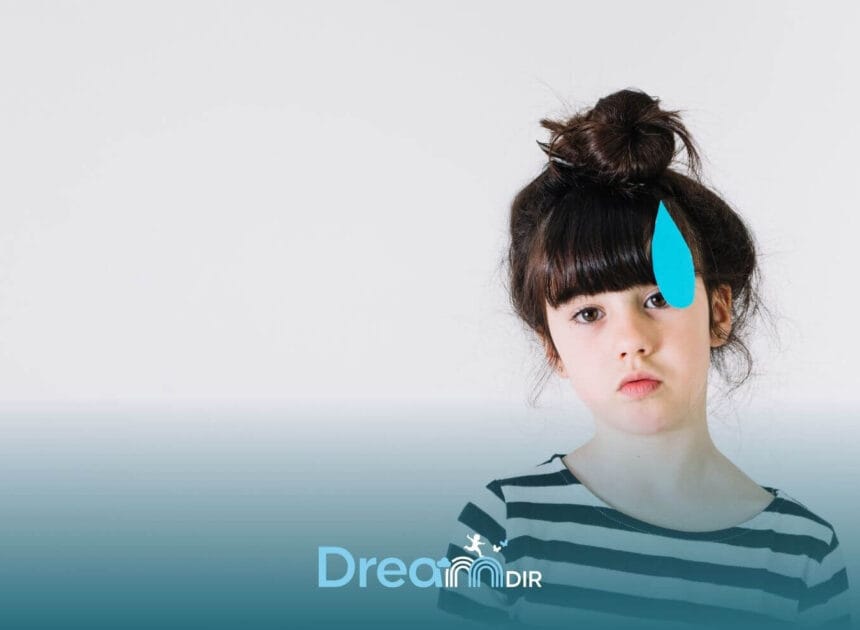 Autistic young girl with a thoughtful expression stands against a plain background with a blue masking symbol beside her face